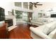 Spacious living room with fireplace, patio access, and view to the back yard and golf course at 1937 Crystal Downs Ct, Oviedo, FL 32765