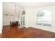 Bright and airy living area with hardwood floors leads to dining space at 1937 Crystal Downs Ct, Oviedo, FL 32765