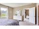 Inviting bedroom with large window and ample space with views of the lush lawn at 194 Amberwood Way, Umatilla, FL 32784