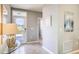 Bright entryway with decorative tile flooring, artwork, and a glass front door to allow lots of natural light at 194 Amberwood Way, Umatilla, FL 32784