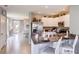 Bright kitchen with granite countertops, stainless steel appliances, and dining area at 194 Amberwood Way, Umatilla, FL 32784