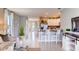 Open concept living area with tile floors, bright light, and modern furnishings at 194 Amberwood Way, Umatilla, FL 32784