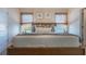 Bright bedroom with a large bed, decorative pillows, and stylish decor that creates a cozy, inviting space at 198 Amberwood Way, Umatilla, FL 32784