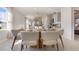 Dining area featuring a round table, fluffy white chairs, and natural light at 198 Amberwood Way, Umatilla, FL 32784