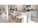 Bright kitchen featuring granite countertops, a kitchen island with bar stool seating, and stainless appliances at 198 Amberwood Way, Umatilla, FL 32784