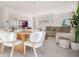 Bright open living space with dining area, a comfortable couch, and neutral decor at 198 Amberwood Way, Umatilla, FL 32784