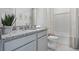 Elegant bathroom featuring a granite countertop, modern fixtures, and a clean, inviting design at 2052 Monteverde Ave, Davenport, FL 33837