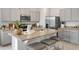 Elegant kitchen featuring a granite countertop, stainless steel appliances, and ample storage space at 2052 Monteverde Ave, Davenport, FL 33837