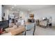 Contemporary kitchen with granite countertops, a stainless steel refrigerator, and an open floor plan to a sitting area at 2052 Monteverde Ave, Davenport, FL 33837
