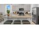 Stylish kitchen with granite countertops, stainless steel appliances, and modern fixtures at 2052 Monteverde Ave, Davenport, FL 33837