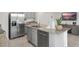 Stylish kitchen island with a stainless dishwasher and refrigerator at 2052 Monteverde Ave, Davenport, FL 33837