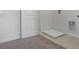 A laundry room with tile and carpet flooring, washer hookups and access door at 2052 Monteverde Ave, Davenport, FL 33837