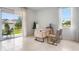 Bright home office with sliding glass doors to the backyard, and a window view at 2052 Monteverde Ave, Davenport, FL 33837