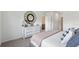 Relaxing bedroom features a statement mirror and plush bedding at 207 Taylor Groves Dr, Lake Wales, FL 33898