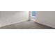 Neutral-toned bedroom featuring neutral walls and carpet and lots of natural light at 207 Taylor Groves Dr, Lake Wales, FL 33898