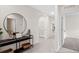 Bright hallway with light-colored walls and tile flooring leading to various rooms of the home at 207 Taylor Groves Dr, Lake Wales, FL 33898