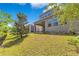Well-maintained backyard with lush green grass and a covered patio area, ideal for outdoor entertaining at 2127 Bay Line Rd, Oakland, FL 34787