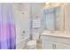 Bathroom with combined shower and tub, white vanity, toilet, and large mirror at 2127 Bay Line Rd, Oakland, FL 34787