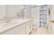 Bathroom with double sinks, bathtub with shower, and decorative curtain at 2127 Bay Line Rd, Oakland, FL 34787