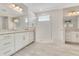 Bathroom with double sinks, granite countertops, and glass enclosed shower at 2127 Bay Line Rd, Oakland, FL 34787