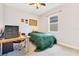 Cozy bedroom with a twin bed, desk, and window view at 2127 Bay Line Rd, Oakland, FL 34787