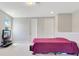 Bonus room featuring neutral carpet, natural light, and a large bed, perfect for relaxation at 2127 Bay Line Rd, Oakland, FL 34787