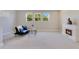 Bonus room featuring neutral carpet, natural light, fireplace and a comfortable couch at 2127 Bay Line Rd, Oakland, FL 34787
