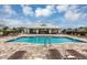 Inviting community pool with ample lounge seating, perfect for relaxation and socializing at 2127 Bay Line Rd, Oakland, FL 34787