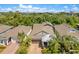 Stunning home with manicured landscaping, charming exterior, and a brick driveway, all near a lush green forest at 2127 Bay Line Rd, Oakland, FL 34787