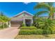 Charming single-story home with lush landscaping and a welcoming brick-paved driveway at 2127 Bay Line Rd, Oakland, FL 34787
