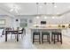 Open-concept kitchen with a center island, pendant lighting, and stainless steel appliances at 2127 Bay Line Rd, Oakland, FL 34787