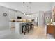 Open kitchen with a center island, white cabinets, and stainless steel appliances at 2127 Bay Line Rd, Oakland, FL 34787