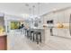 Open-concept kitchen with a large island, granite countertops, and stainless steel appliances at 2127 Bay Line Rd, Oakland, FL 34787