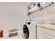 Efficient laundry room featuring modern washer and dryer, sink and storage at 2127 Bay Line Rd, Oakland, FL 34787