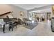 Spacious living room flowing into a kitchen, showcasing an open floor plan and piano at 2127 Bay Line Rd, Oakland, FL 34787