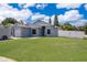 Beautiful single-level home with a lush green lawn and modern exterior paint at 2164 Rj Cir, Kissimmee, FL 34744