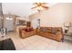 Bright living room offers neutral tile flooring and comfortable seating, perfect for relaxation at 2164 Rj Cir, Kissimmee, FL 34744