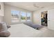 Bedroom featuring plush carpeting, a queen sized bed, and walk in closet at 2203 Gopher Tortoise Ter, Oakland, FL 34787
