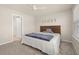 Comfortable bedroom featuring plush carpeting and a queen sized bed at 2203 Gopher Tortoise Ter, Oakland, FL 34787