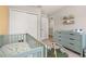 Comfortable Bedroom space with closet, dresser, crib, and natural light for a growing Gathering at 2203 Gopher Tortoise Ter, Oakland, FL 34787