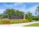 Attractive community sign 'Longleaf at Oakland' with lush greenery and clear blue skies at 2203 Gopher Tortoise Ter, Oakland, FL 34787
