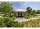 Community entrance with lush landscaping, bicycle racks, and welcoming architecture at 2203 Gopher Tortoise Ter, Oakland, FL 34787