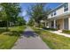 Street view showcasing well-maintained townhouses with lush landscaping and inviting walkways at 2203 Gopher Tortoise Ter, Oakland, FL 34787