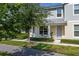 Charming townhouse with a cozy front patio, perfect for enjoying the outdoors at 2203 Gopher Tortoise Ter, Oakland, FL 34787