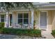 Townhouse porch featuring an intimate seating area and neat landscaping at 2203 Gopher Tortoise Ter, Oakland, FL 34787