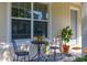 A close up view of the porch with outdoor seating and a plant in a pot at 2203 Gopher Tortoise Ter, Oakland, FL 34787