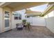 Cozy outdoor patio featuring brick flooring and a sunshade, perfect for relaxing and entertaining at 2203 Gopher Tortoise Ter, Oakland, FL 34787