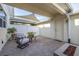 Enclosed brick patio area with shade sail, and fire pit at 2203 Gopher Tortoise Ter, Oakland, FL 34787