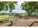 Community playground with a seesaw and swings, providing a fun and safe environment for children at 2203 Gopher Tortoise Ter, Oakland, FL 34787