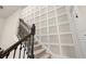 Staircase featuring decorative wood trim and iron railing leading to the upper floor at 2203 Gopher Tortoise Ter, Oakland, FL 34787
